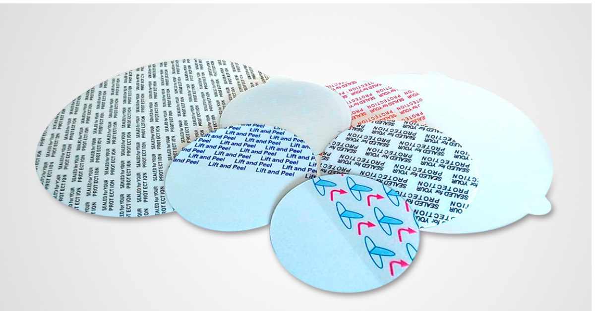 Gilpack inserting cap liners and assembling childresistant caps